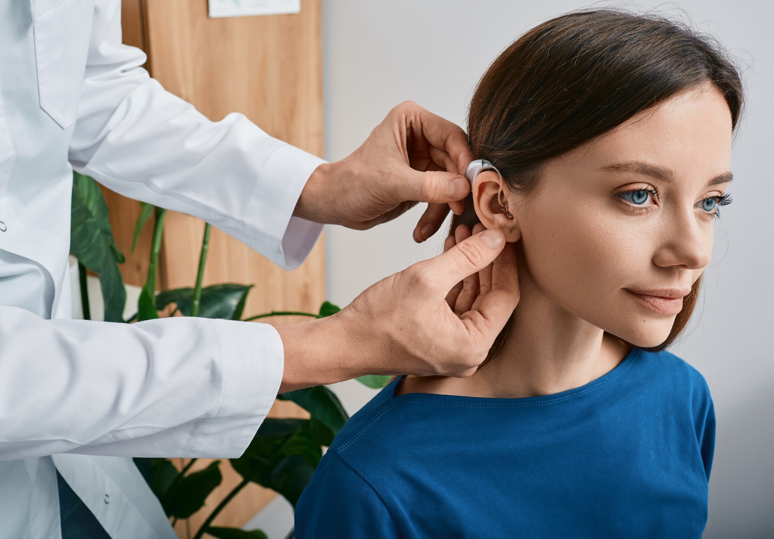 Installation,Hearing,Aid,On,Woman’s,Ear,At,Hearing,Clinic,,Close-up,